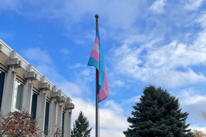The transgender pride flag flying at the Castlegar Campus