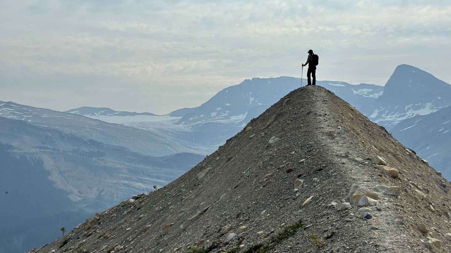 Image of man standing on mountain top