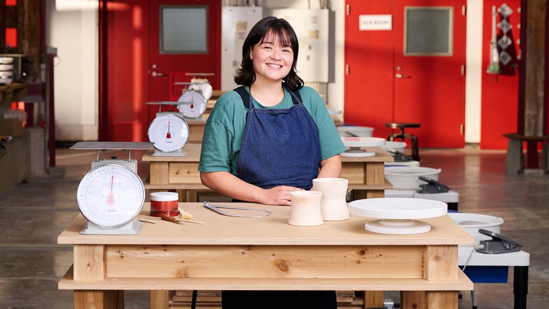 Ceramics alumna on pottery throwdown set
