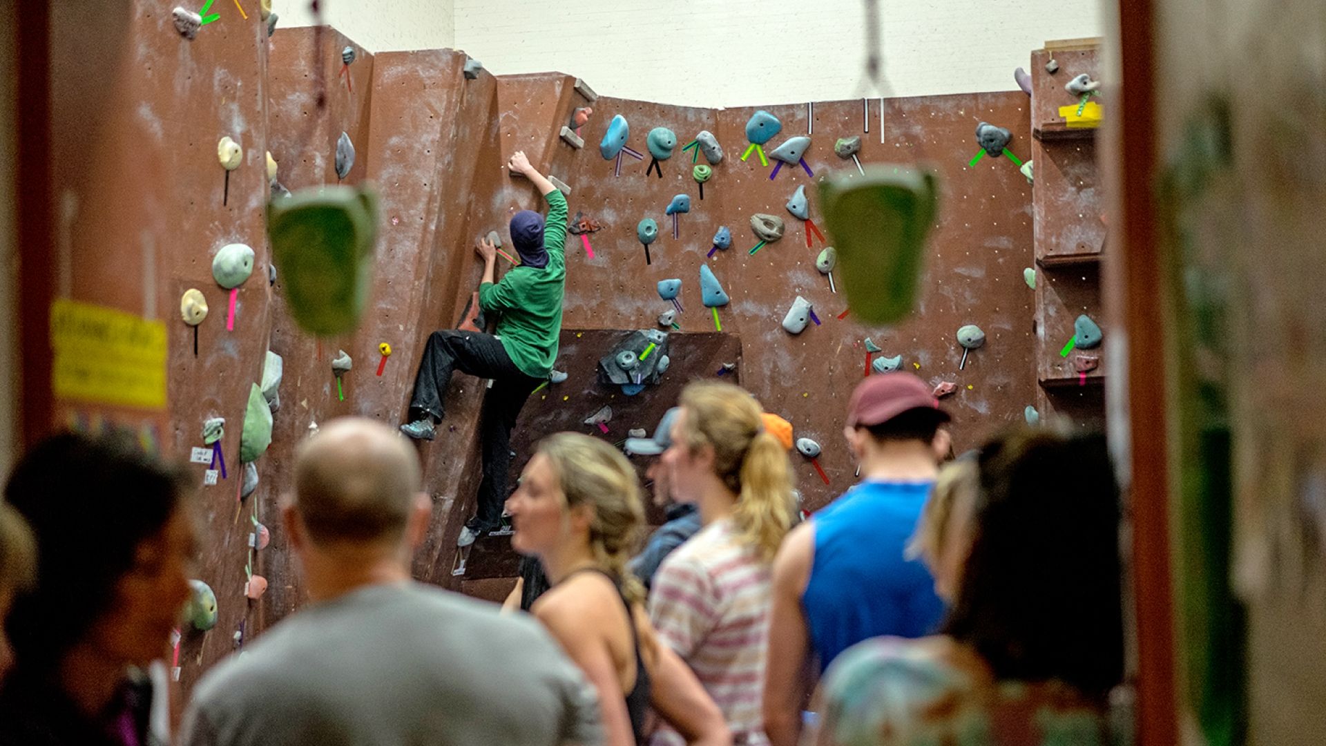 students climbing the rock wall