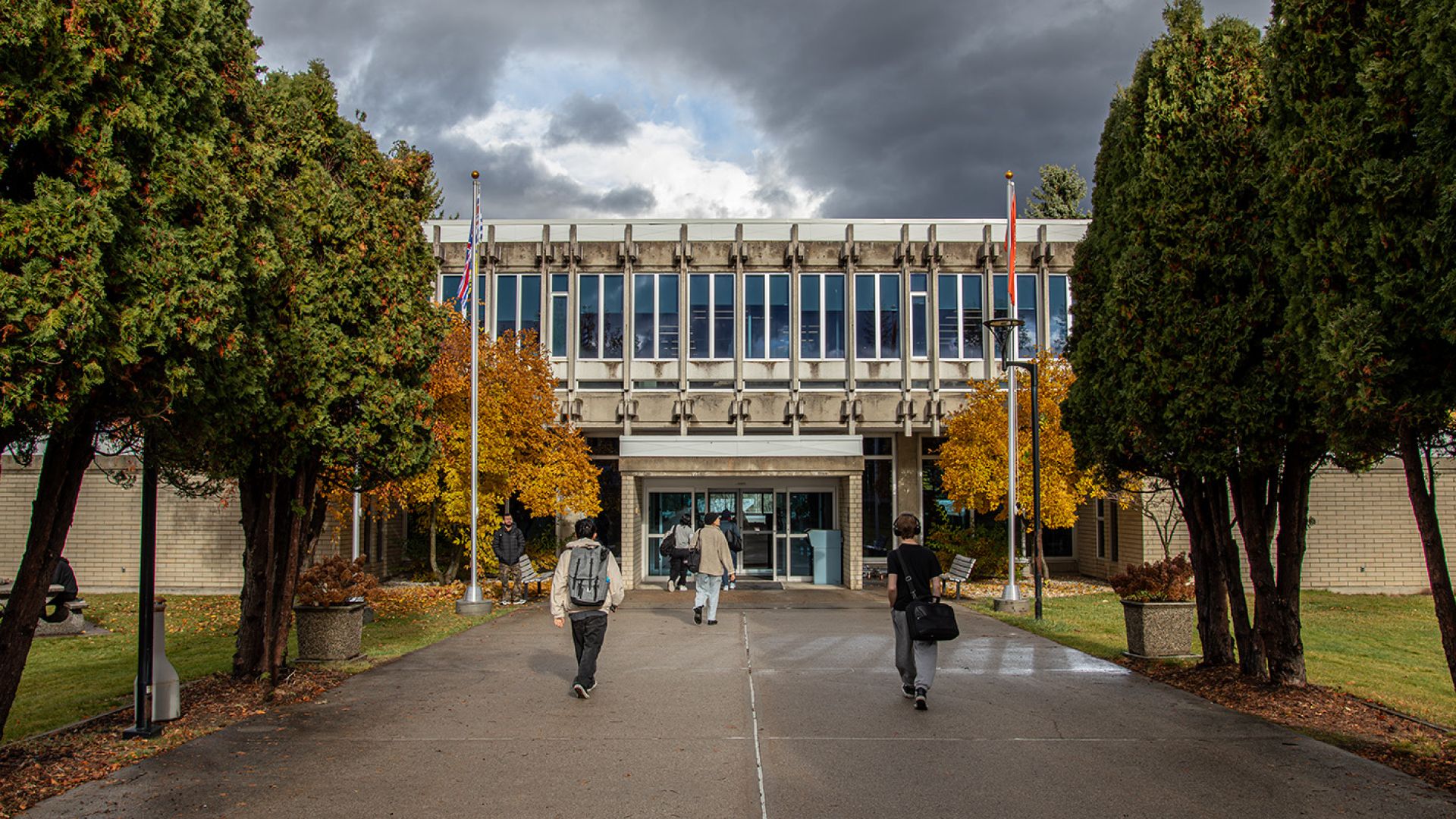 Selkirk College student walking on campus in the fall
