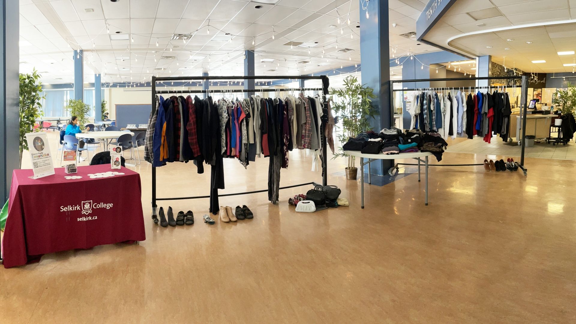 Clothing hanging on racks within a common space at Selkirk College