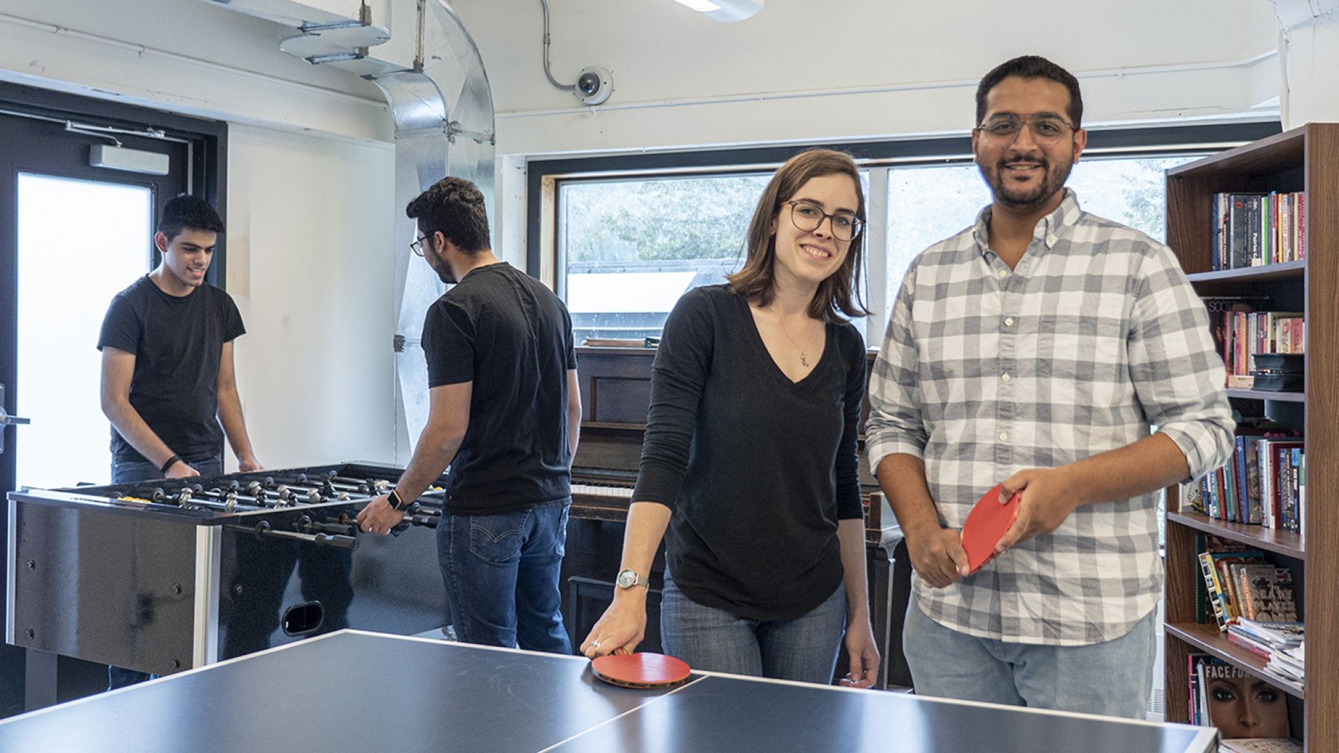 Students playing ping pong in Student Housing, Tenth Street Campus