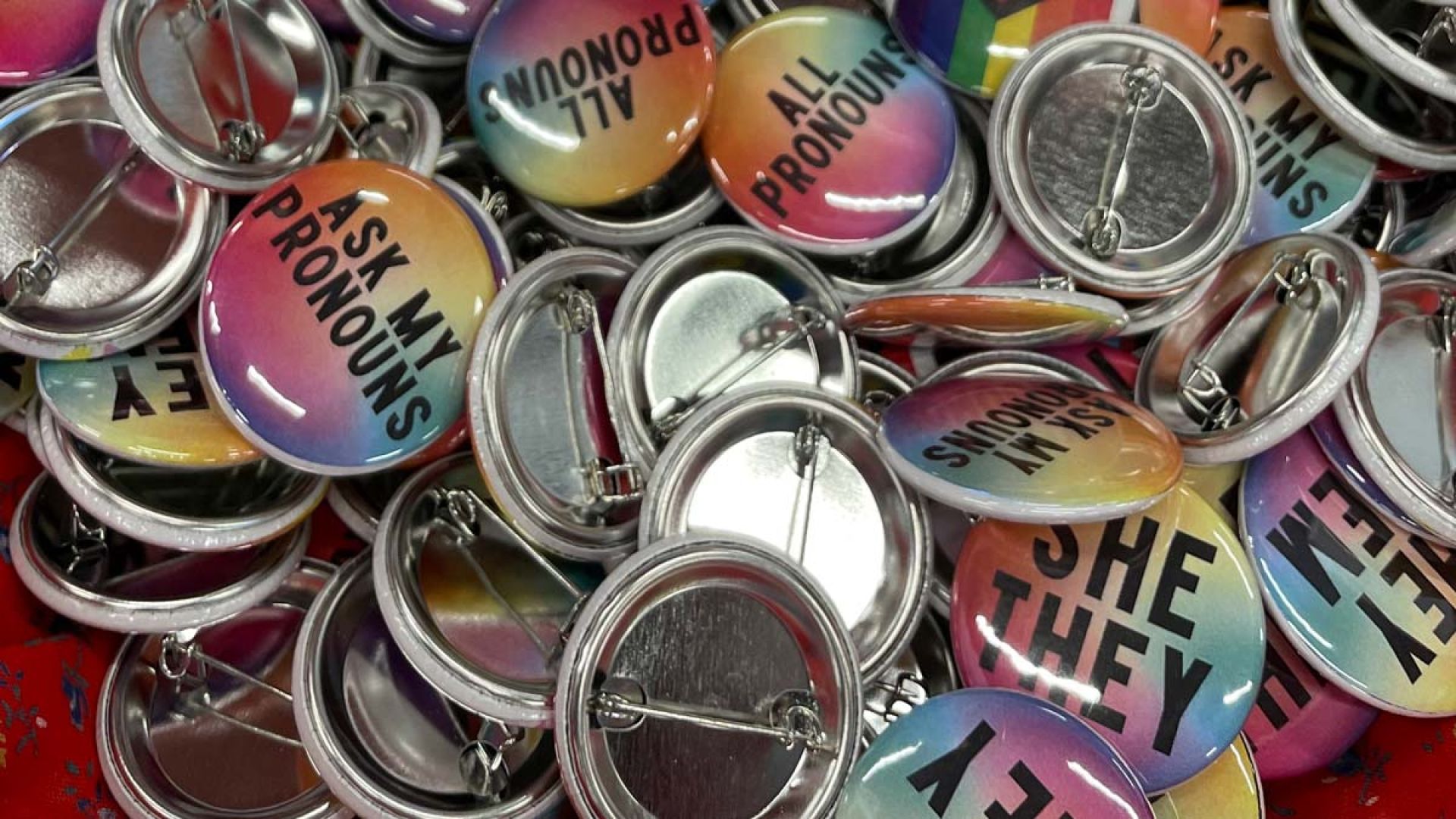 A basketful of pins with pronouns