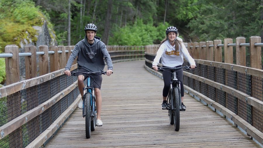 Students riding the Rail Trail on bikes