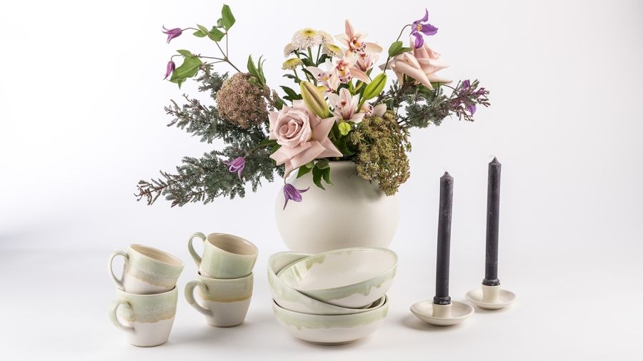 ceramic table set with flowers in vase