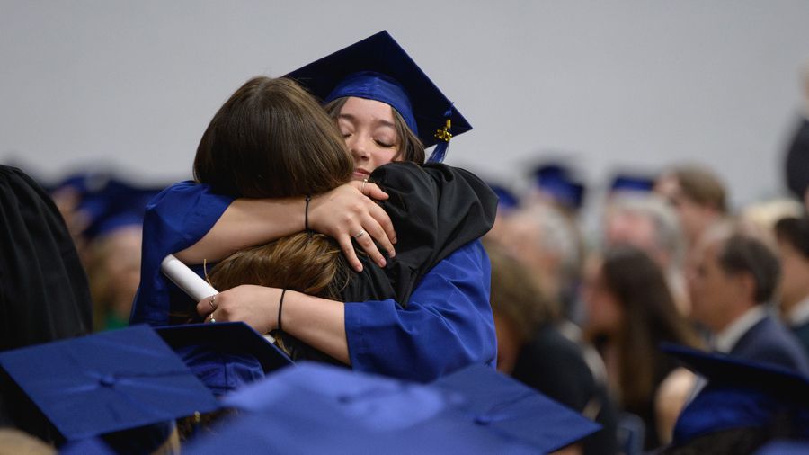 Selkirk College students hugging at Convocation