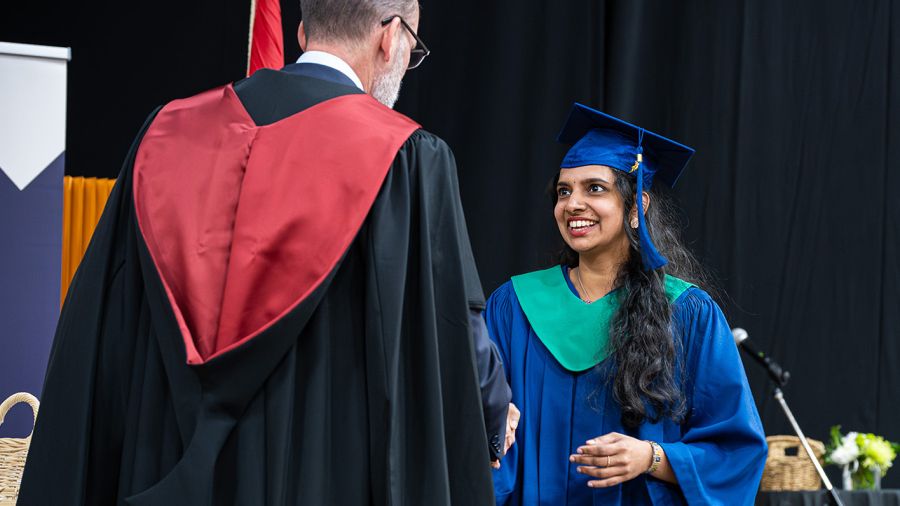 Student smiling at Convocation