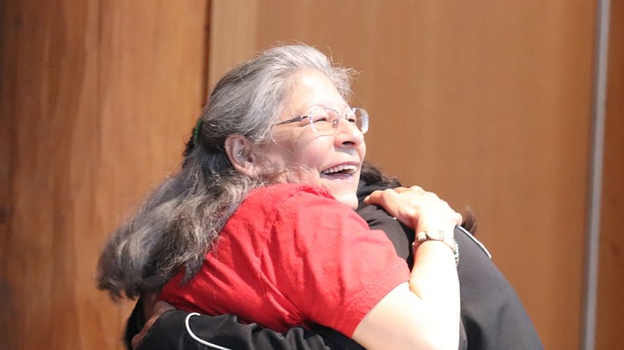 Indigenous Elders hugging at the Gathering Place