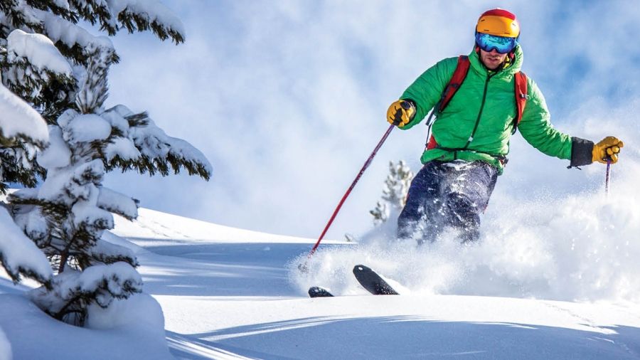 A skier wearing a green jacket