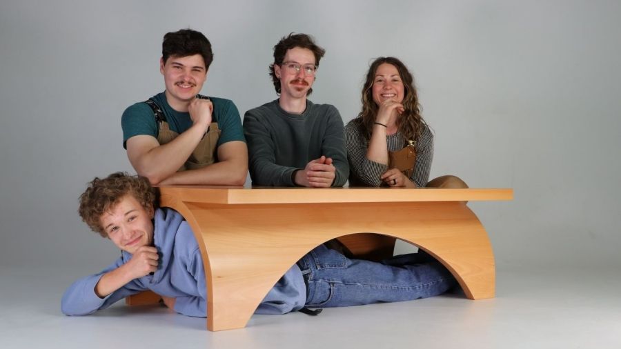 Students with a handmade table