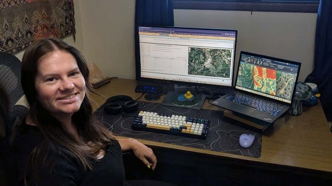 Intern Hannah Murphy sits at a desk in front of a computer 