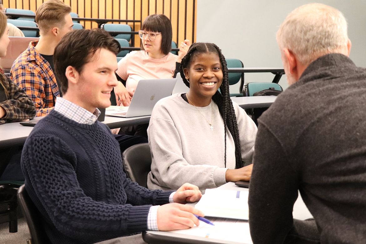Business students sitting in a class with an instructor