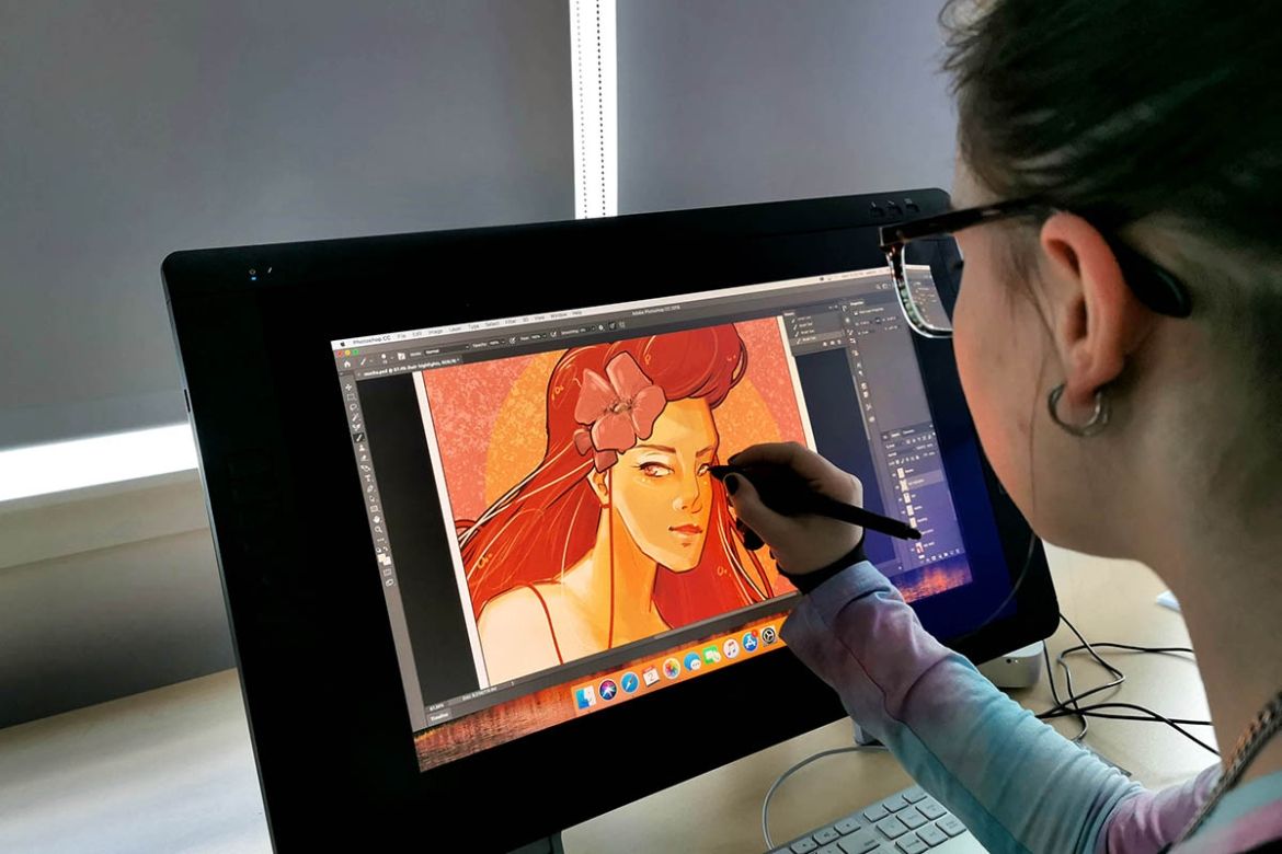 student working on digital art