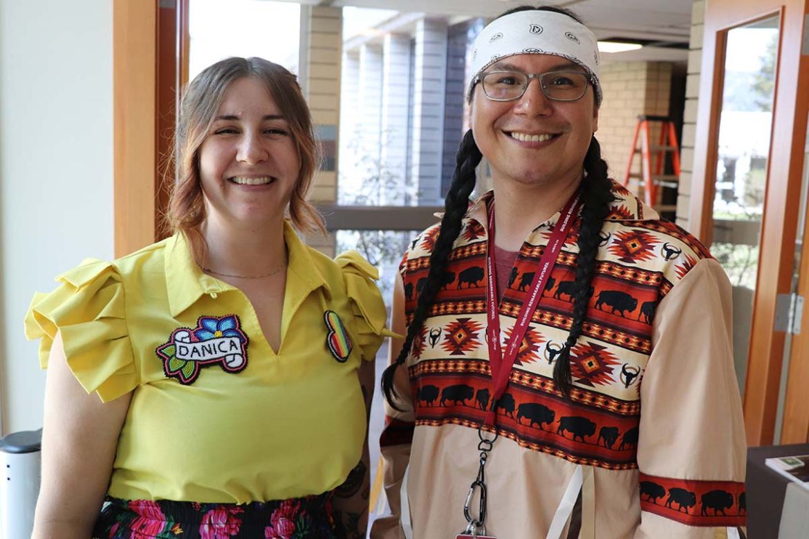 Danica and Rodney stand together smiling