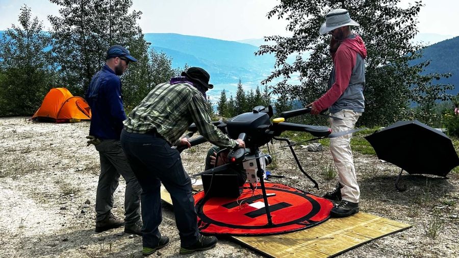 GIS team works on setting up the drone