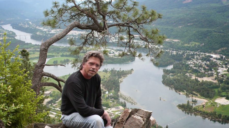 Myler Wilkinson sits outside by the Columbia River