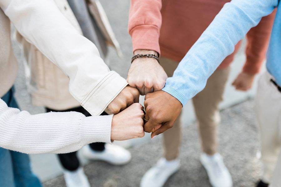 students fist bumping