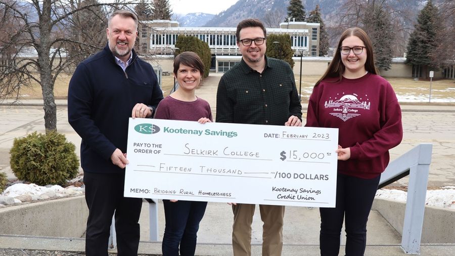 Cheque donation featuring Selkirk College and KSCU staff.