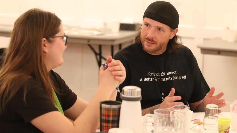 David Tomlen from the Trail Community Action Team in conversation at the West Kootenay Homelessness Response Summit