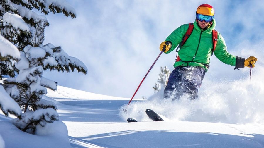 A skier wearing a green jacket