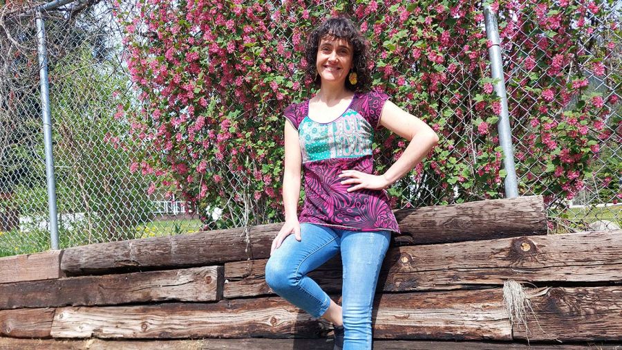 Barbara stands outside smiling