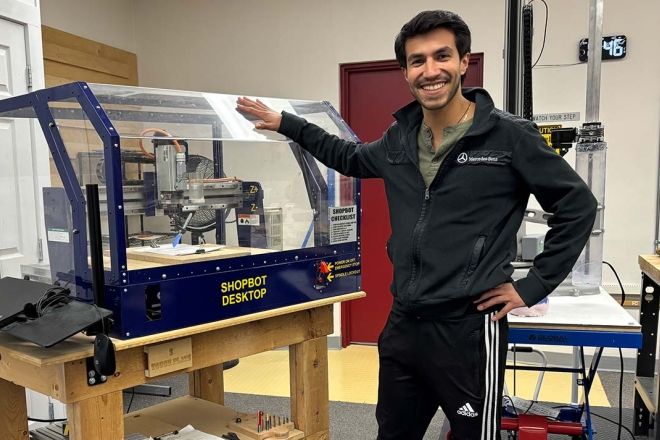 Digital Fabrication & Design student Raul Pous Facha beside a 3D scanner