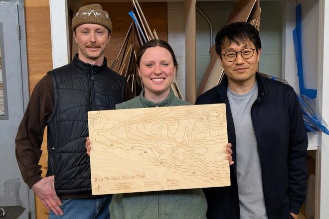 Three GIS Students holding their tangible map