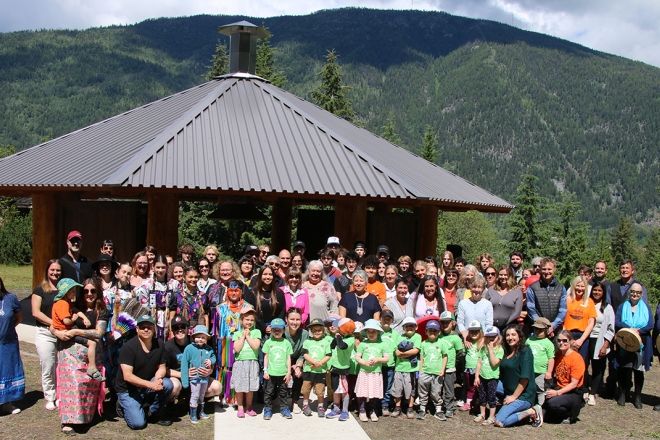 Group photo of the 80 people who attended the Tenth Street Indigenous Gathering Place opening on June 17