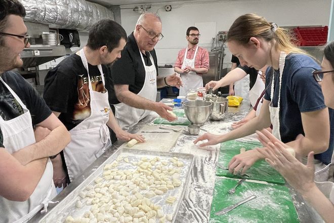 Students make gnocchi together
