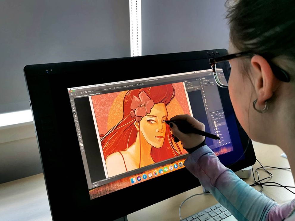 student working on digital art