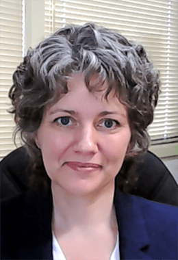 Marilyn Rivers smiles in her office